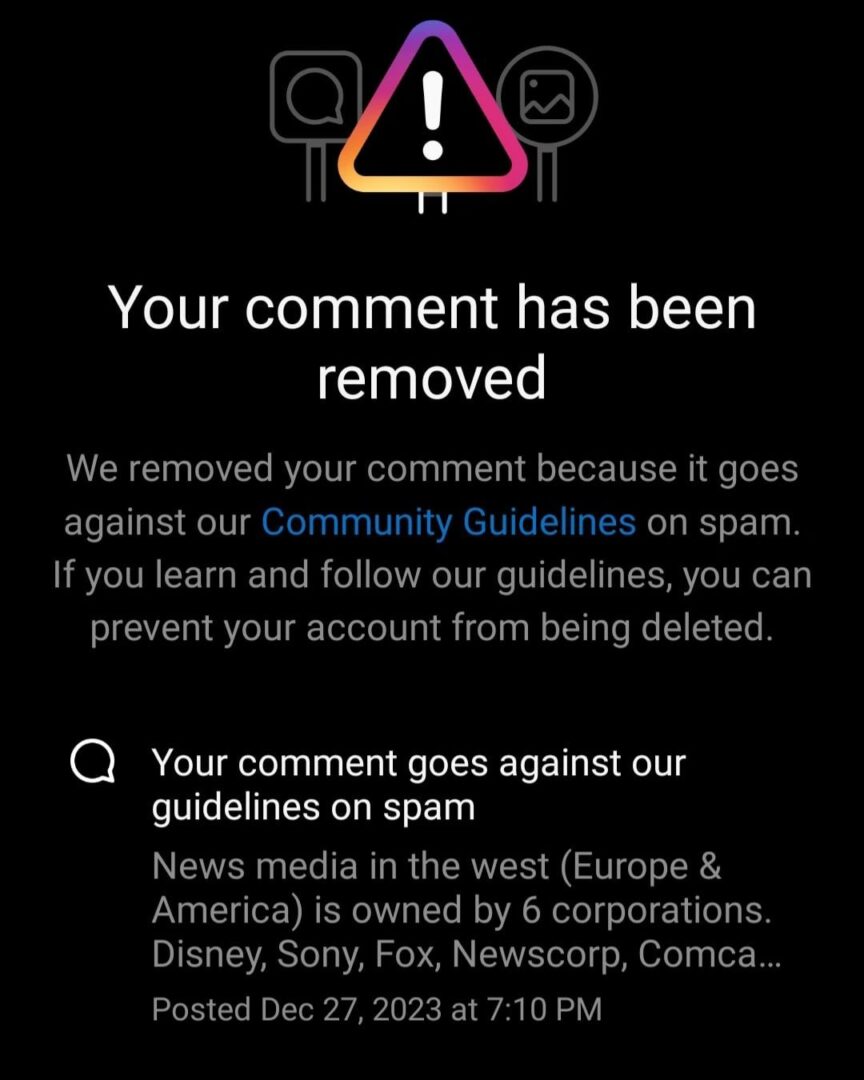 Notification of comment removal for violating community guidelines on spam.