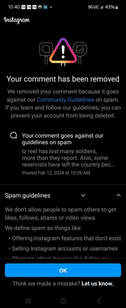 Screenshot of a social media comment warning about spam guidelines.