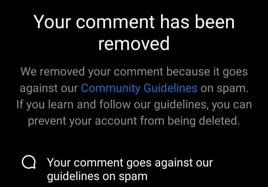 Notification of comment removal for violating community guidelines on spam.