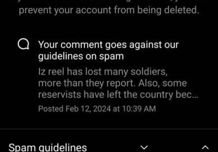Screenshot of a social media comment warning about spam guidelines.